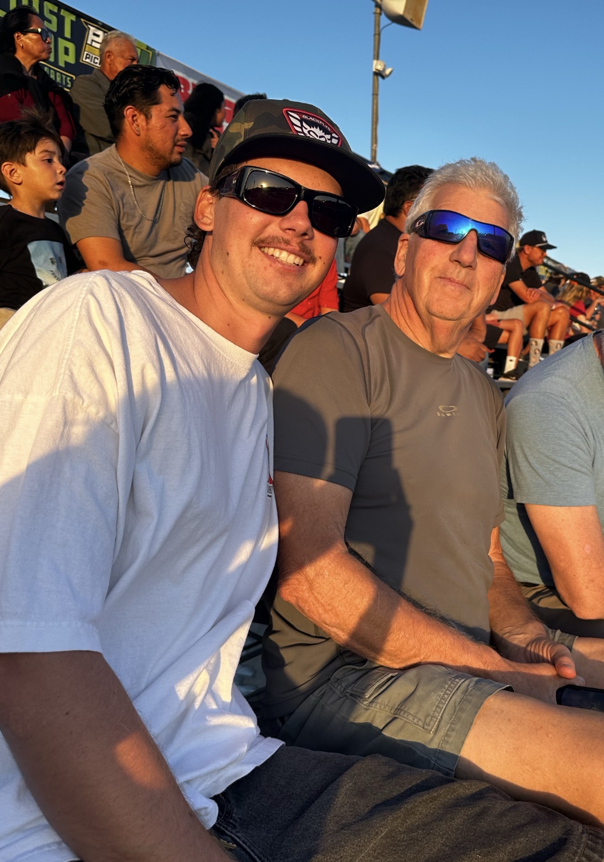 JB Enterprises founder and his son together at an outdoor event